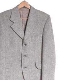 Vintage 1970s Harris Tweed jacket. Made in England by Gurtex. Beautiful grey weave with classic wide notched lapels from the era. Three front pockets and twin vent reverse. Fully inside lined. Label reads 38".